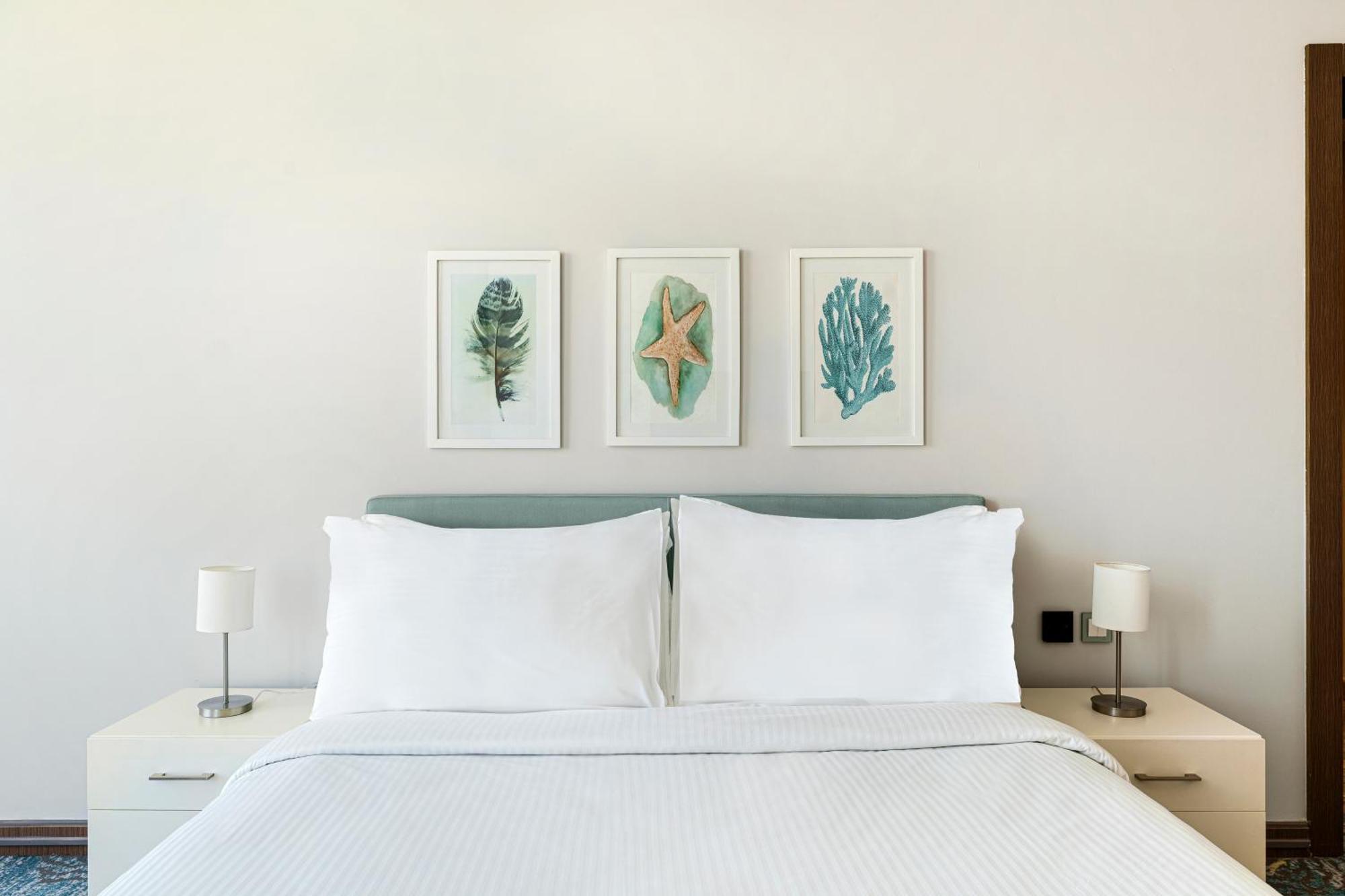 Rixos Premium Alamein Ελ Αλαμέιν Δωμάτιο φωτογραφία A bedroom at the hotel